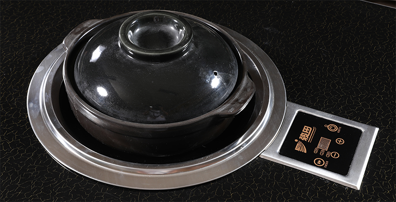 JHD‑420E commercial concave ceramic cooker working scene with black casserole pot on table